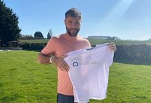 Charlie Austin holding Your Move football jersey