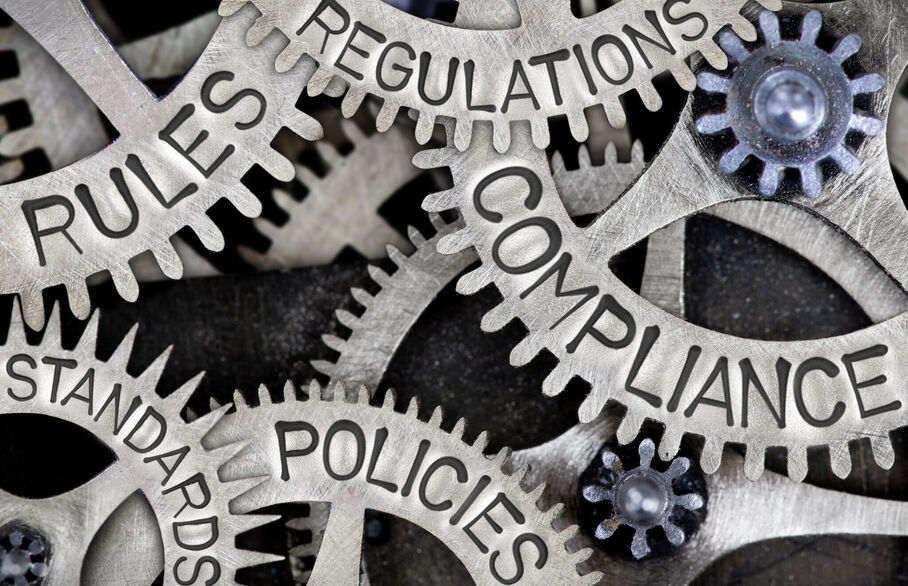 Cogs with the words, legislation, regulation and rules on them