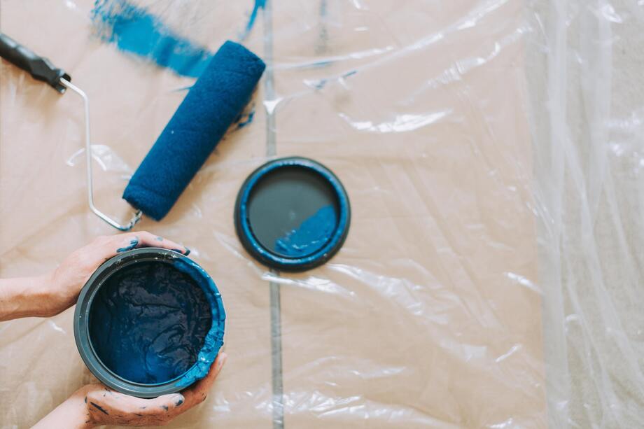 Blue paint and rollers on the floor